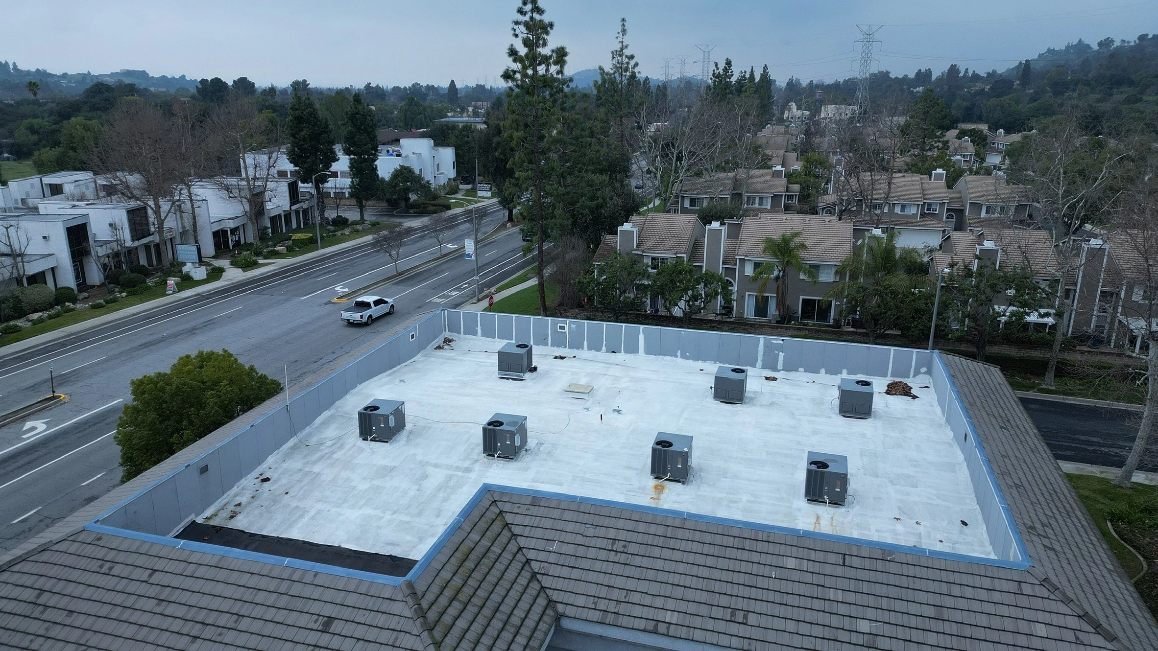 HVAC technician servicing a residential unit, performing system diagnostics or maintenance in the field